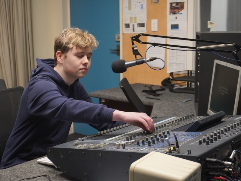 Henderson using the studio desk
