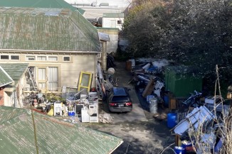 Outdoor photos of one of Hill's properties showing industrial garbage