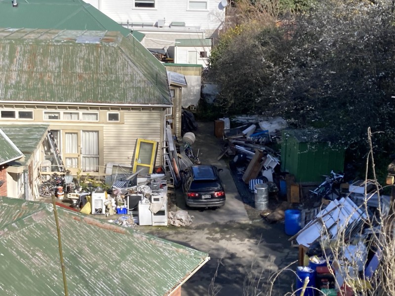 Outdoor photos of one of Hill's properties showing industrial garbage