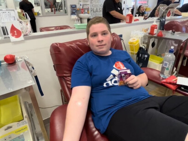 Nicholas donating