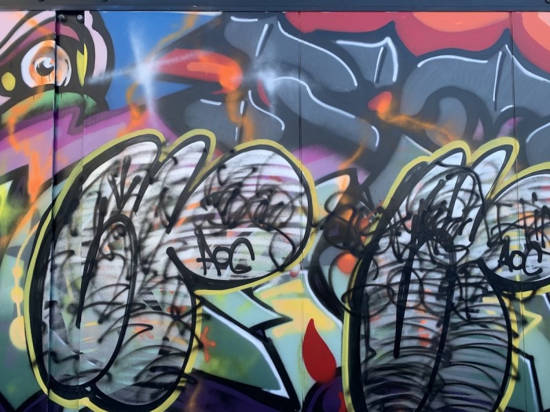 Graffiti over mural
