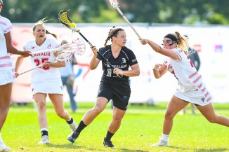 Sian playing lacrosse against Canada at the 2017 World Cup